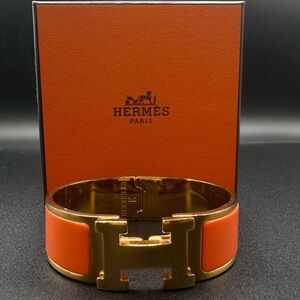 Hermes Clic Clac H Orange enamel gold tone bracelet